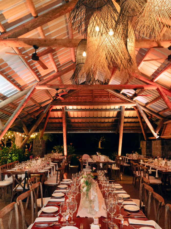 Evening reception beneath woven pendant lights
