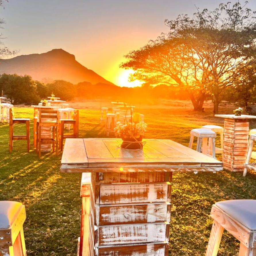 Outdoor tables at sunset at Domaine Walinzi