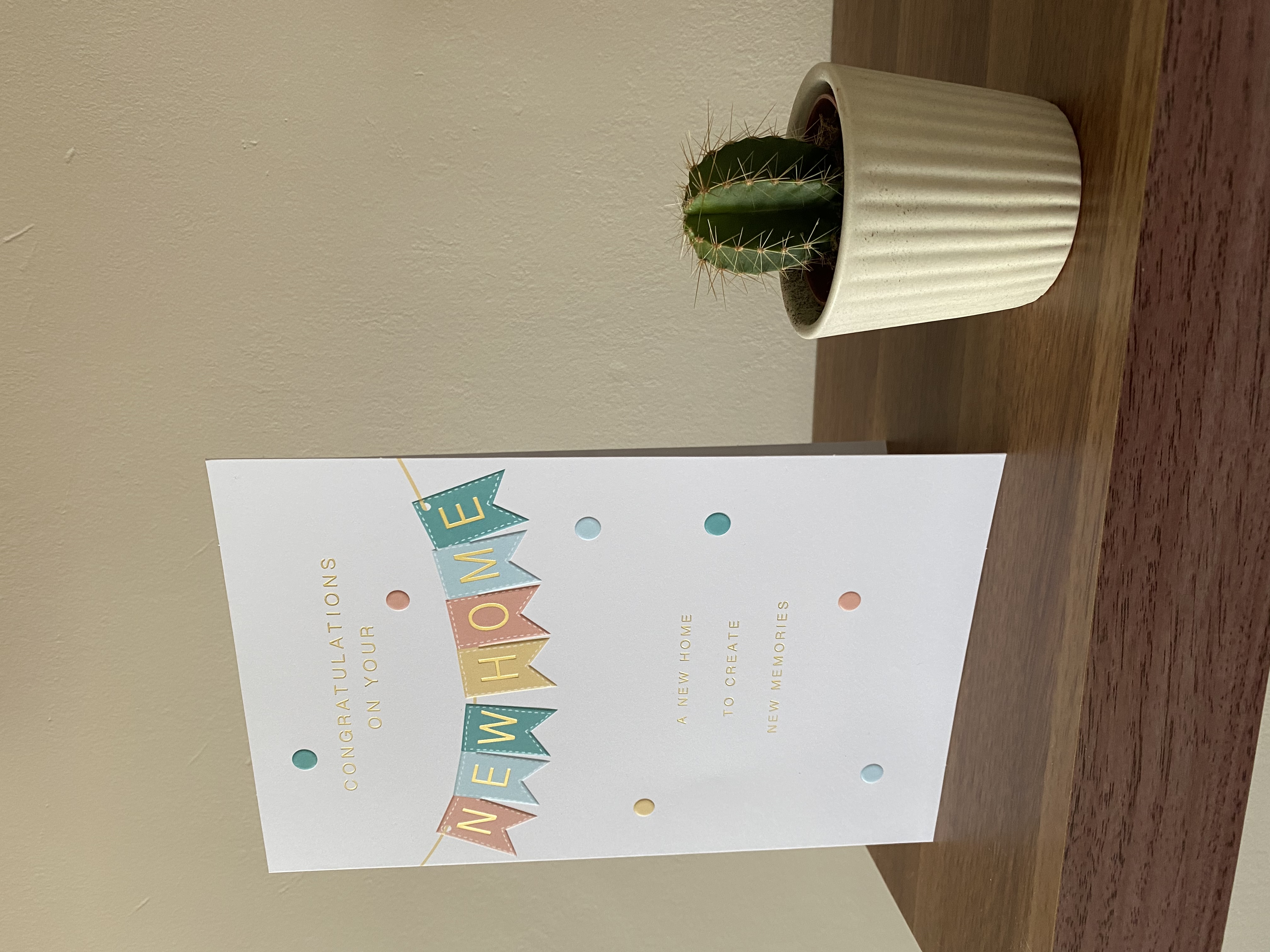 A new-home card and cactus in 2021