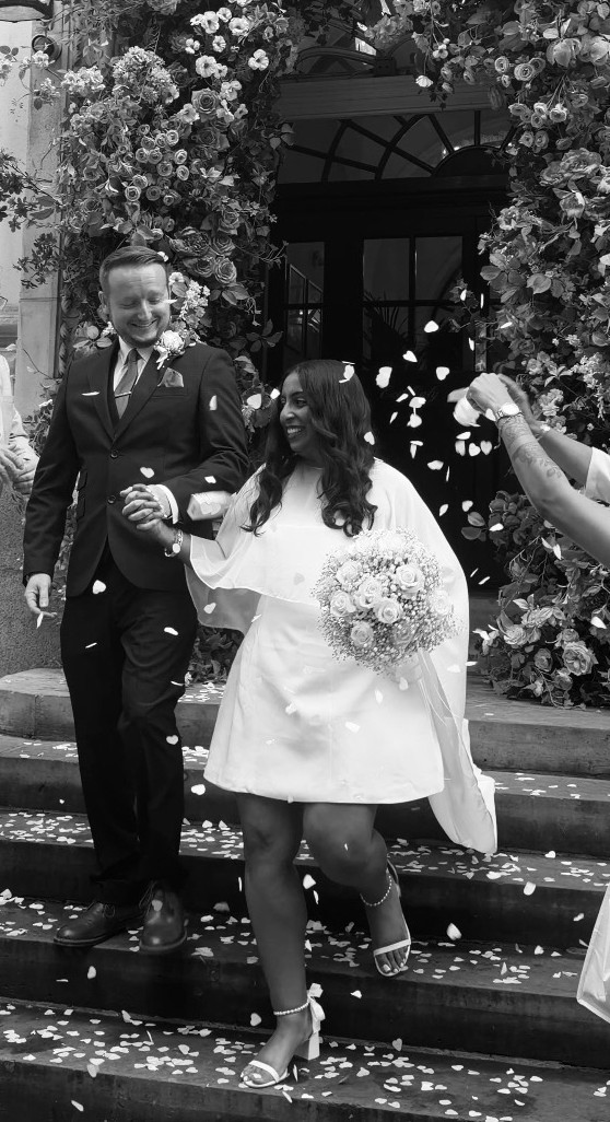 Dan and Mal leaving their civil wedding under a shower of confetti